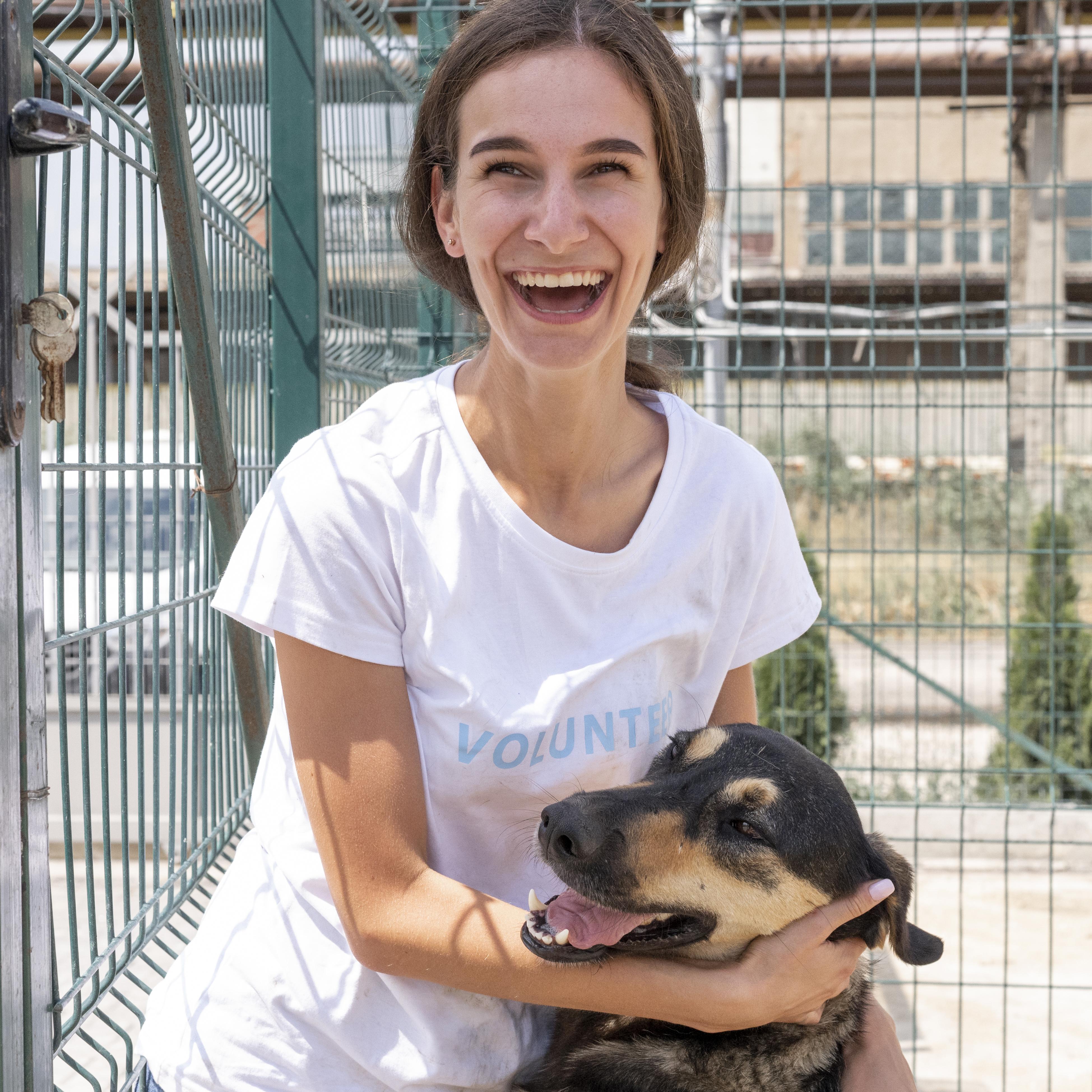 files/smiley-woman-with-cute-dog-waiting-be-adopted-by-someone.jpg